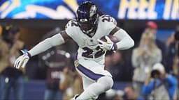 Baltimore Ravens running back Derrick Henry (22) carries the ball against cornerback Elijah Molden (22) in the second half at SoFi Stadium.