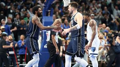 Dallas Mavericks guard Kyrie Irving (11) celebrates with Dallas Mavericks guard Luka Doncic (77) during the fourth quarter against the Memphis Grizzlies at American Airlines Center.