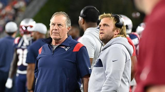 New England Patriots head coach Bill Belichick (left) and Steve Belichick, linebackers coach (right) watch the in stadium displays during the first half of a preseason against the Carolina Panthers game at Gillette Stadium.