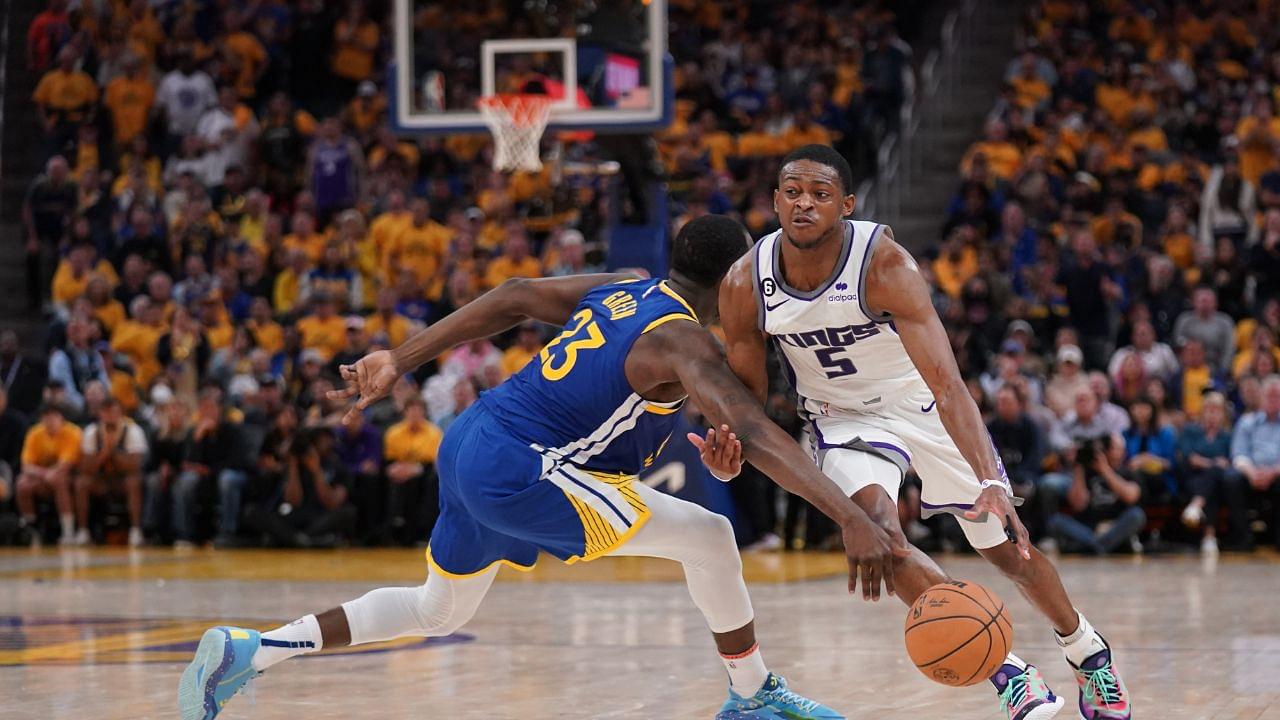 Draymond Green (L) and De'Aaron Fox (R)