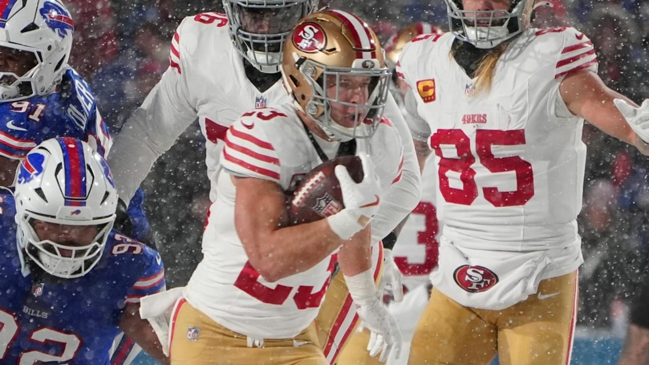 Dec 1, 2024; Orchard Park, New York, USA; San Francisco 49ers running back Christian McCaffrey (23) runs with the ball against the Buffalo Bills during the first half at Highmark Stadium.