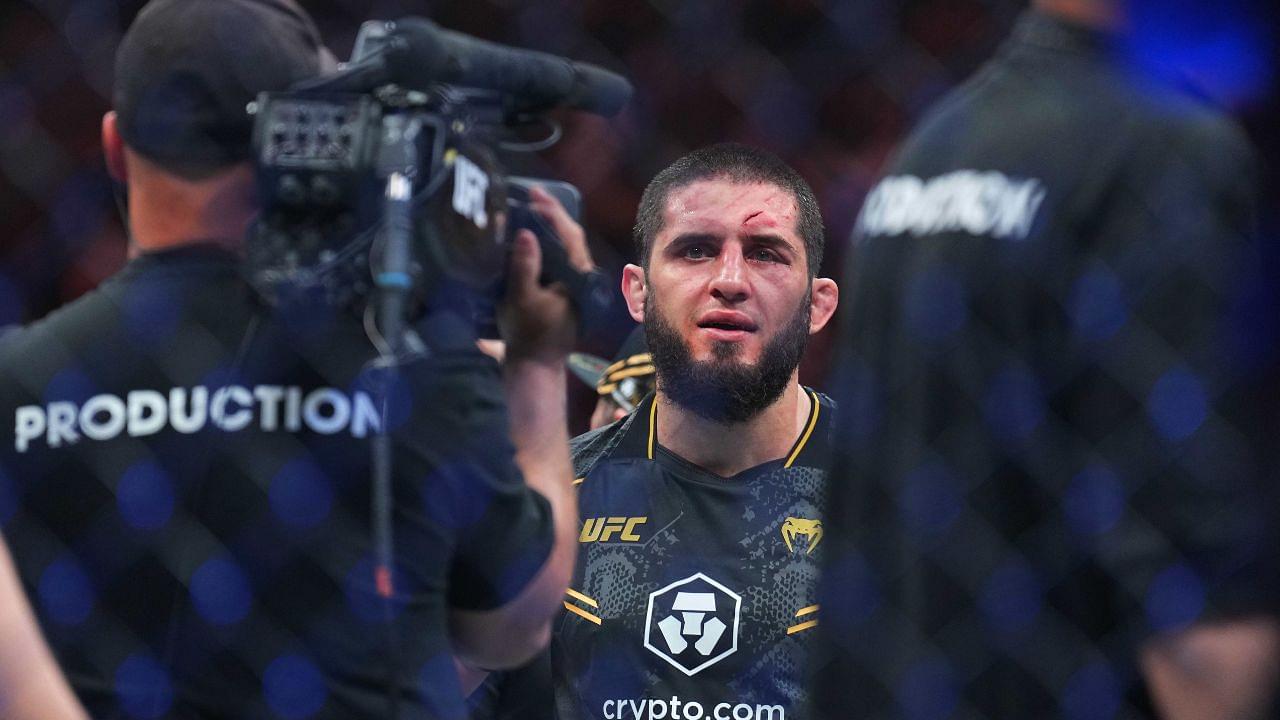 ; Islam Makhachev (red gloves) celebrates defeating Dustin Poirier (blue gloves) during UFC 302 at Prudential Center.