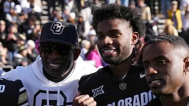 Nov 29, 2024; Boulder, Colorado, USA; Colorado Buffaloes safety Shilo Sanders (21) and head coach Deion Sanders and quarterback Shedeur Sanders (2) and social media producer Deion Sanders Jr. following the win against the Oklahoma State Cowboys at Folsom Field.