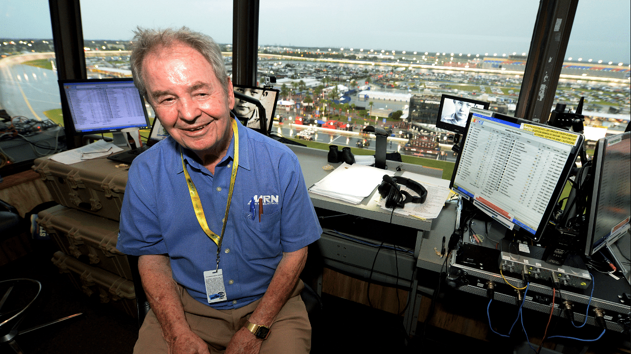 Jul 5, 2014; Daytona Beach, FL, USA; Motor Racing Network radio announcer Barney Hall pauses for a portrait in the radio booth during the Coke Zero 400 at Daytona International Speedway. Mandatory Credit: John David Mercer-Imagn Images