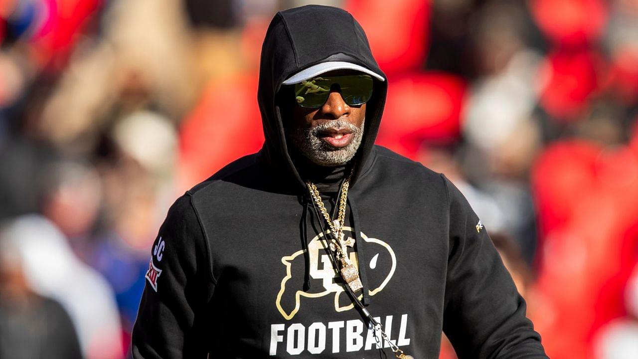 Colorado head coach Deion Sanders watches his players warmup prior to the game between the Kansas Jayhawks and the Colorado Buffaloes at GEHA Field at Arrowhead Stadium.