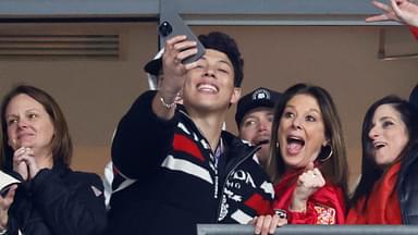 Jan 28, 2024; Baltimore, Maryland, USA; Brittany Mahomes (L) and Jackson Mahomes (M) celebrate in a suite against the Baltimore Ravens in the final minute in the AFC Championship football game at M&T Bank Stadium.