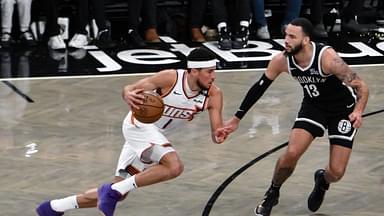 Phoenix Suns guard Devin Booker (1) drives to the basket while being defended by Brooklyn Nets guard Tyrese Martin (13) during the second half at Barclays Center