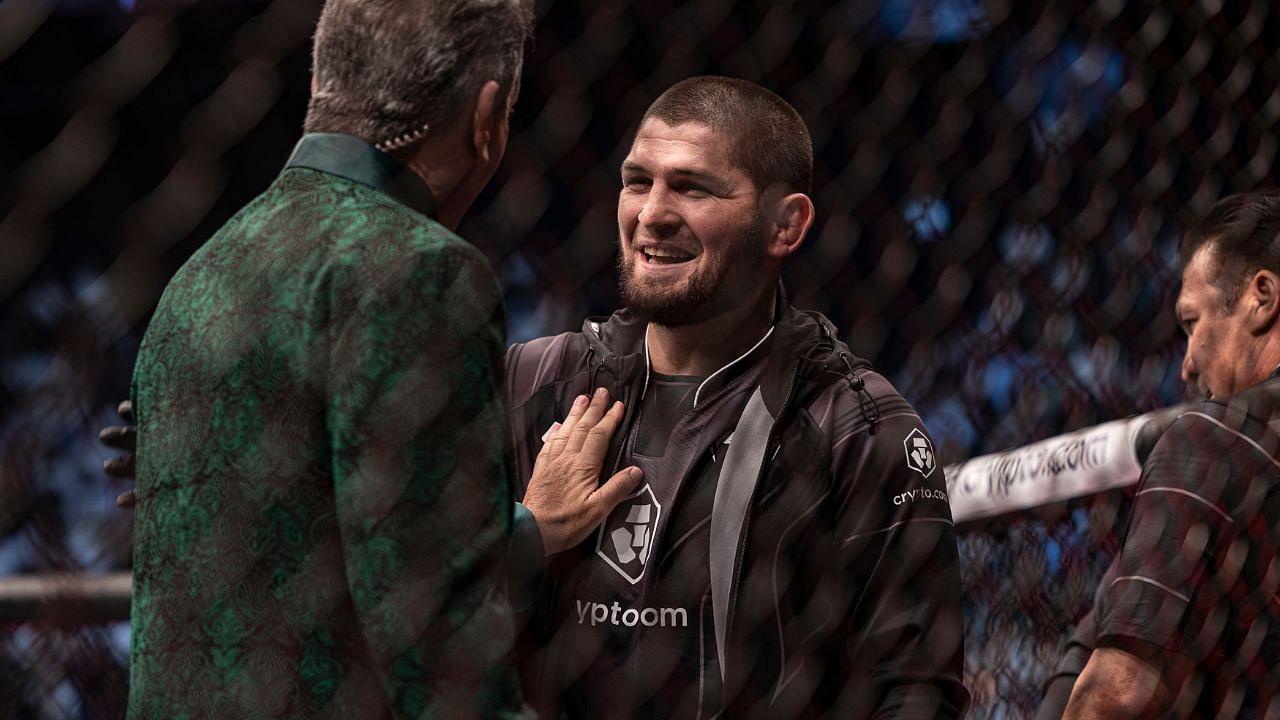 Khabib Nurmagomedov (right) greets Bruce Buffer (left) after the fight between Abubakar Nurmagomedov (red gloves) and Gadzhi Omargadzhiev (blue gloves) during UFC 280 at Etihad Arena.