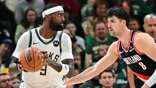 Milwaukee Bucks forward Bobby Portis (9) is guarded by Portland Trail Blazers forward Deni Avdija (8) in the second quarter at Fiserv Forum.