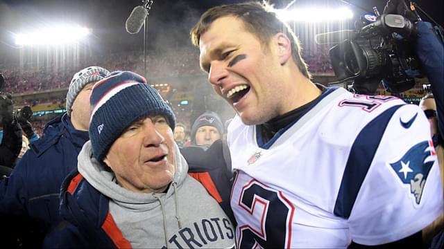 New England Patriots head coach Bill Belichick and quarterback Tom Brady (12) celebrate the win over the Kansas City Chiefs during overtime in the AFC Championship game at Arrowhead Stadium.