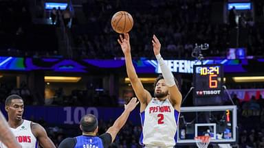 Detroit Pistons guard Cade Cunningham (2) shoots against Orlando Magic guard Jalen Suggs (4) during the first quarter at Kia Center.