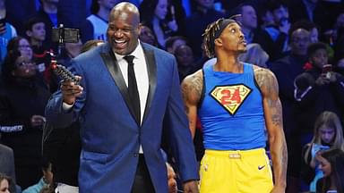 Former NBA player Shaquille O'Neal laughs while standing next to Los Angeles Lakers player Dwight Howard during the slam dunk contest during NBA All Star Saturday Night at United Center.