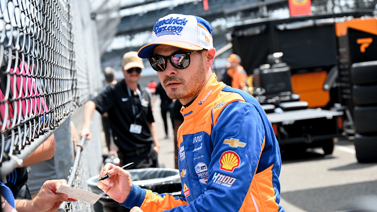 Arrow McLaren/Rick Hendrick driver Kyle Larson (17) signs autographs Monday, May 20, 2024, during practice for the 108th running of the Indianapolis 500 at Indianapolis Motor Speedway.