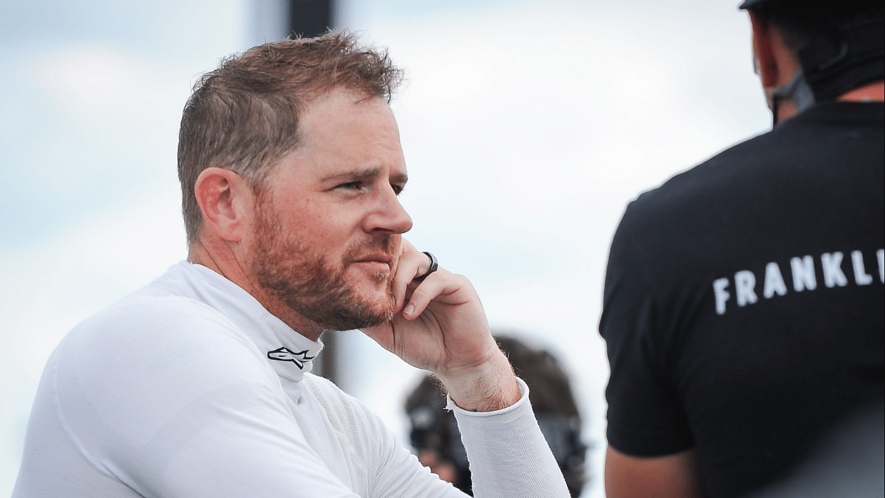 Justin Marks talks with a crew member after Trans Am practice Friday, July 7, 2023, at Road America in Elkhart Lake, Wisconsin.