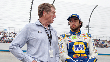 NASCAR Cup Series driver Chase Elliott (right) stands with his father and former driver Bill Elliott (left) prior to the AAA Drive for Autism at Dover International Speedway.