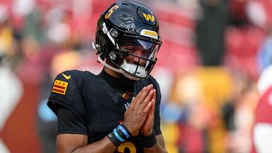 Washington Commanders quarterback Jayden Daniels (5) warms up before the NFL, American Football Herren, USA game between the Tennessee Titans and the Washington Commanders in Landover