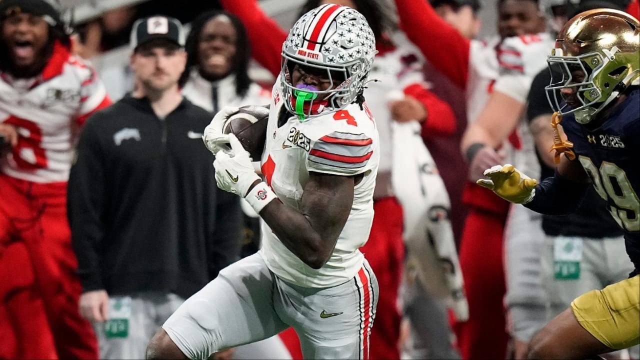 Ohio State Buckeyes wide receiver Jeremiah Smith (4) makes a catch against Notre Dame Fighting Irish cornerback Christian Gray (29) in the fourth quarter during the College Football Playoff National Championship at Mercedes-Benz Stadium in Atlanta on January 20, 2025.