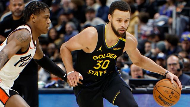 Golden State Warriors guard Stephen Curry (30) dribbles against Detroit Pistons guard Marcus Sasser (25) in the second half at Little Caesars Arena.