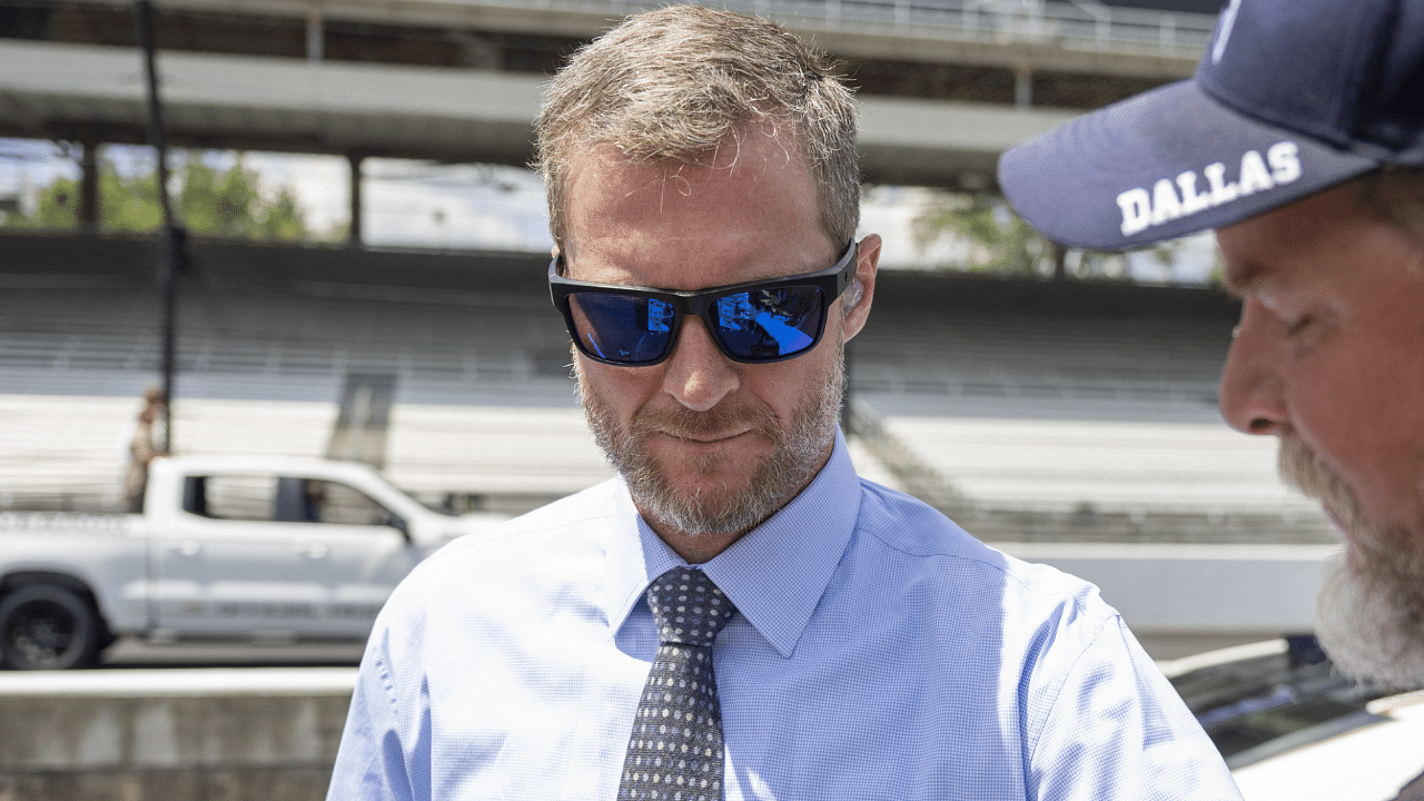 Dale Earnhardt Jr. signs an autograph before the Verizon 200 at the Indianapolis Motor Speedway Road Course.