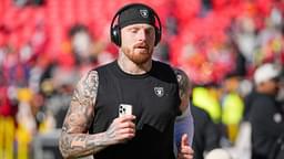 Las Vegas Raiders defensive end Maxx Crosby (98) warms up against the Kansas City Chiefs prior go a game at GEHA Field at Arrowhead Stadium.