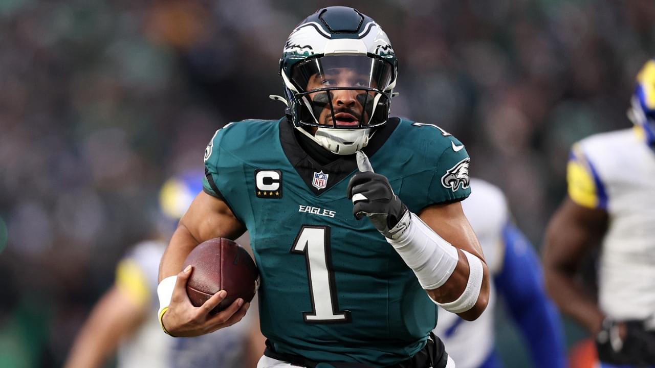 Jan 19, 2025; Philadelphia, Pennsylvania, USA; Philadelphia Eagles quarterback Jalen Hurts (1) runs for a touchdown against the Los Angeles Rams during the first quarter in a 2025 NFC divisional round game at Lincoln Financial Field.