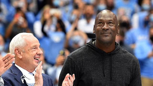 Former North Carolina Tar Heels head coach Roy Williams with former UNC great Michael Jordan on the court as they were honored as part of the 1982 national championship team in the second half at Dean E. Smith Center.