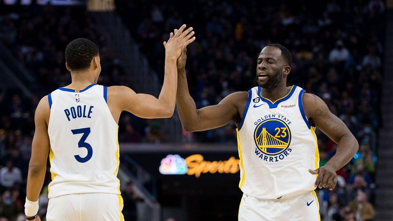 Golden State Warriors guard Jordan Poole (3) and forward Draymond Green (23) celebrate after Poole drew a foul against the Brooklyn Nets during the first half at Chase Center.