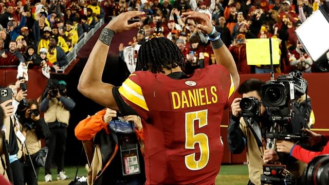 Dec 29, 2024; Landover, Maryland, USA; Washington Commanders quarterback Jayden Daniels (5) celebrates while leaving the field after the Commanders' game against the Atlanta Falcons at Northwest Stadium.