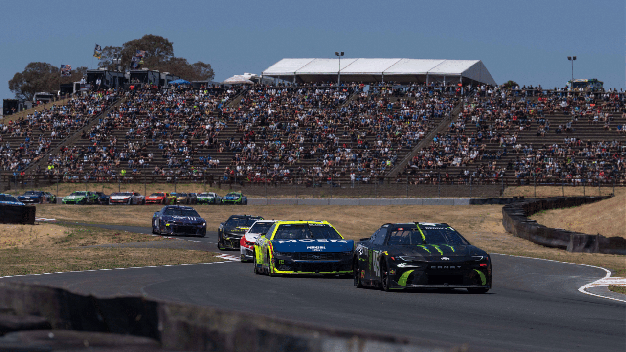 Jun 9, 2024; Sonoma, California, USA; NASCAR Cup Series driver Tyler Reddick (45) leads the group during the Toyota / Save Mart 350 at Sonoma Raceway. Mandatory Credit: Stan Szeto-Imagn Images