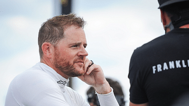 Justin Marks talks with a crew member after Trans Am practice Friday, July 7, 2023, at Road America in Elkhart Lake, Wisconsin.