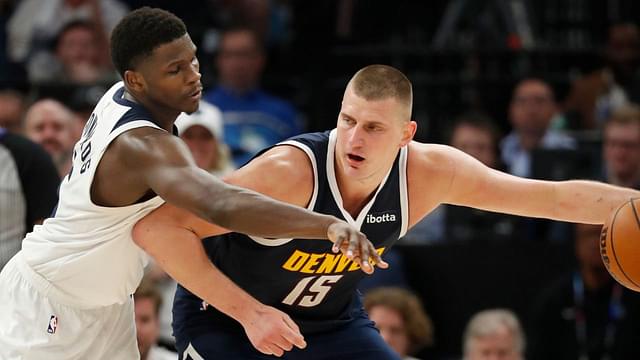 Denver Nuggets center Nikola Jokic (15) works around Minnesota Timberwolves guard Anthony Edwards (5) in the fourth quarter of game four of the second round for the 2024 NBA playoffs at Target Center.