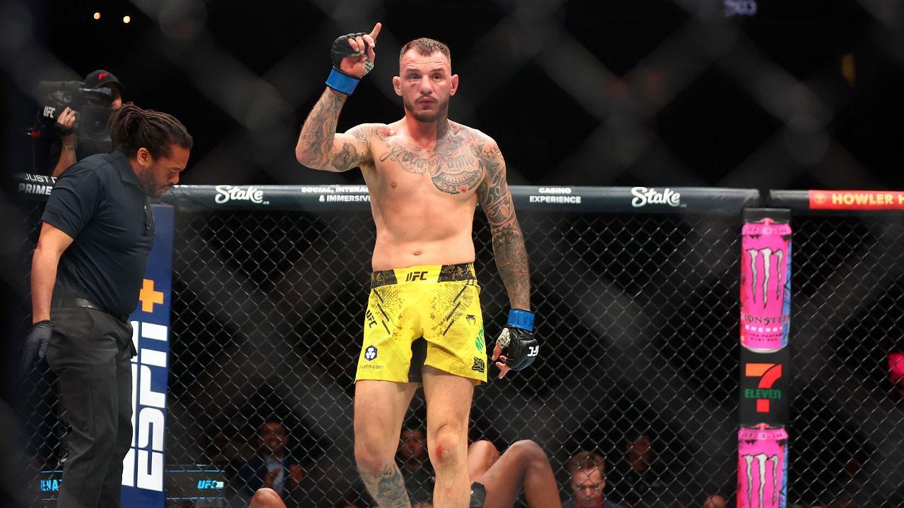 Renato Moicano (blue gloves) reacts after defeating Jalin Turner (red gloves) during UFC 300 at T-Mobile Arena.