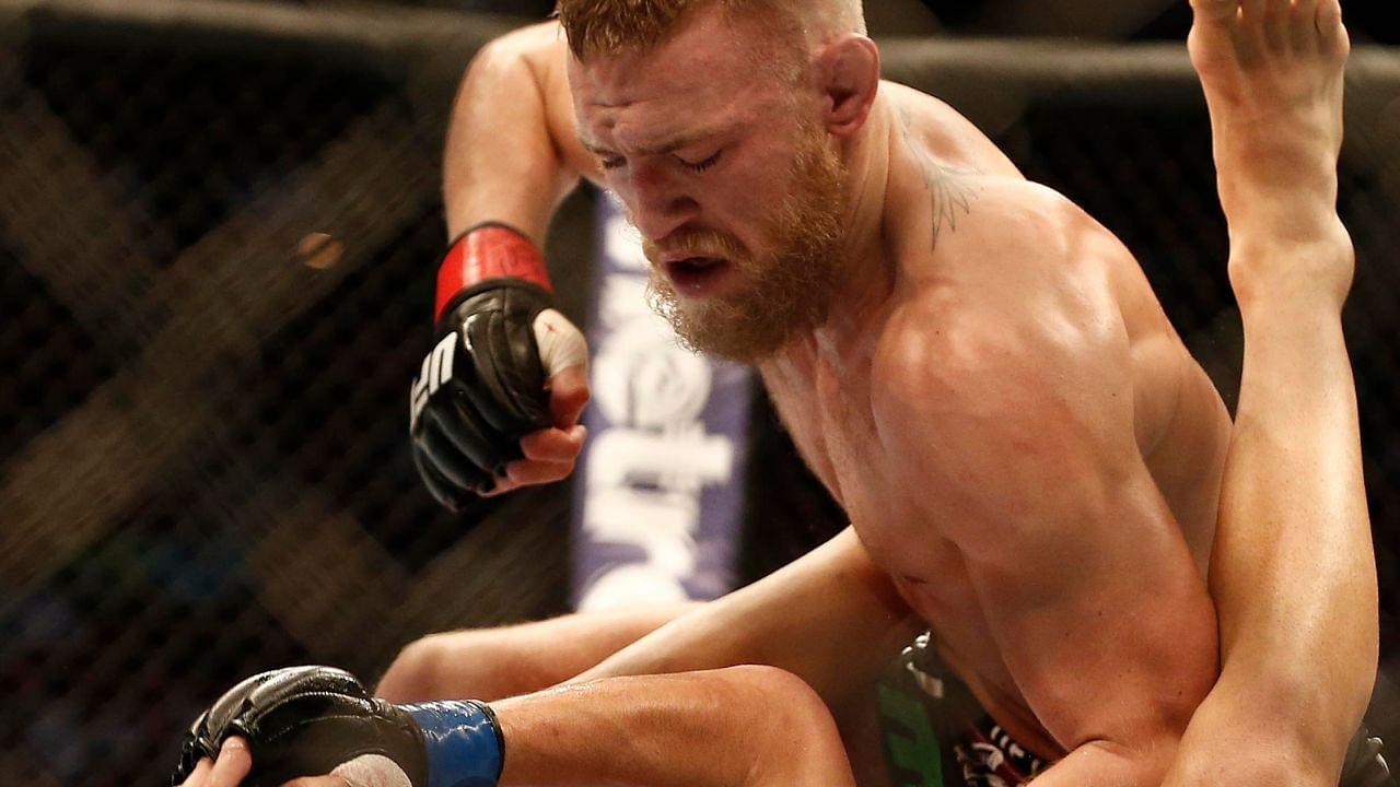 Conor McGregor (black shorts) and Max Holloway (white shorts) fight during a UFC featherweight match at the TD Garden. McGregor won after three rounds by judges decision.