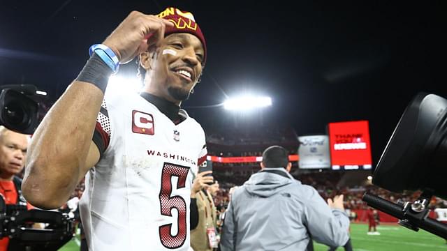 Washington Commanders quarterback Jayden Daniels (5) celebrates after winning a NFC wild card playoff against the Tampa Bay Buccaneers at Raymond James Stadium.