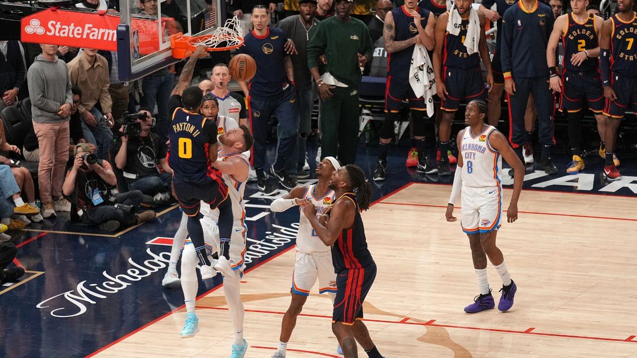 Golden State Warriors guard Gary Payton II (0) dunks the ball over Oklahoma City Thunder center Isaiah Hartenstein (55) in the fourth quarter at the Chase Center