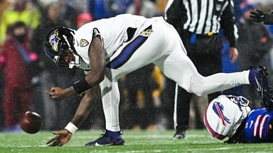 Jan 19, 2025; Orchard Park, New York, USA; Baltimore Ravens quarterback Lamar Jackson (8) fumbles the ball during the second quarter against the Buffalo Bills in a 2025 AFC divisional round game at Highmark Stadium.