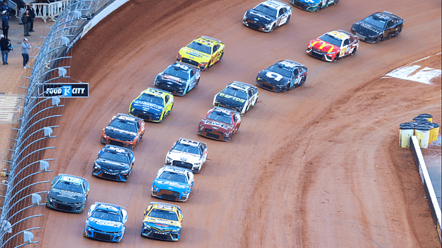 Apr 9, 2023; Bristol, Tennessee, USA; NASCAR Cup Series driver Kyle Larson (5) leads the restart behind the pace truck at the Bristol Motor Speedway Dirt Course. Mandatory Credit: Randy Sartin-Imagn Images