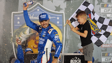 NASCAR Cup Series driver Kyle Larson (5) and his son Owen after winning the Bass Pro Shops Night Race at Bristol Motor Speedway.