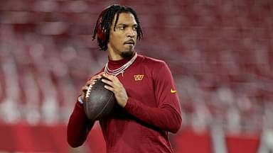 Washington Commanders quarterback Jayden Daniels (5) warms up before a NFC wild card playoff against the Tampa Bay Buccaneers at Raymond James Stadium.