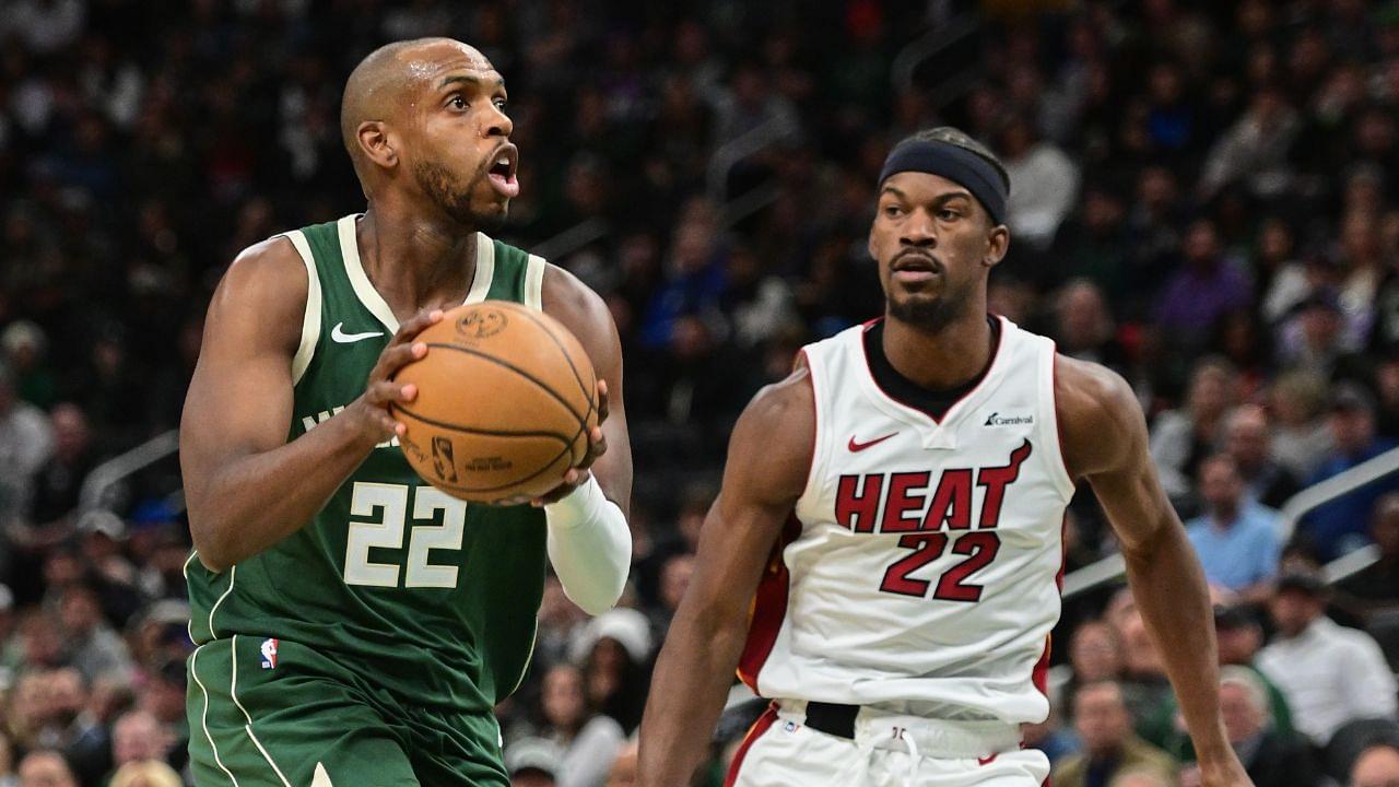 Milwaukee Bucks center Khris Middleton (22) takes a shot against Miami Heat center Jimmy Butler (22) in the second quarter at Fiserv Forum.