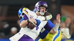 Los Angeles Rams defensive lineman Neville Gallimore (92) sacks Minnesota Vikings quarterback Sam Darnold (14) during their playoff game at State Farm Stadium on Jan. 13, 2025, in Glendale. The Rams beat the Vikings, 27-9.