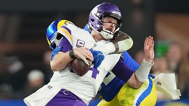 Los Angeles Rams defensive lineman Neville Gallimore (92) sacks Minnesota Vikings quarterback Sam Darnold (14) during their playoff game at State Farm Stadium on Jan. 13, 2025, in Glendale. The Rams beat the Vikings, 27-9.