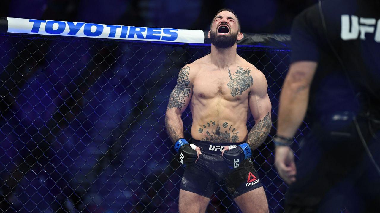 Mike Perry (blue gloves) reacts before a bout against Geoff Neal (not pictured) during UFC 245 at T-Mobile Arena.