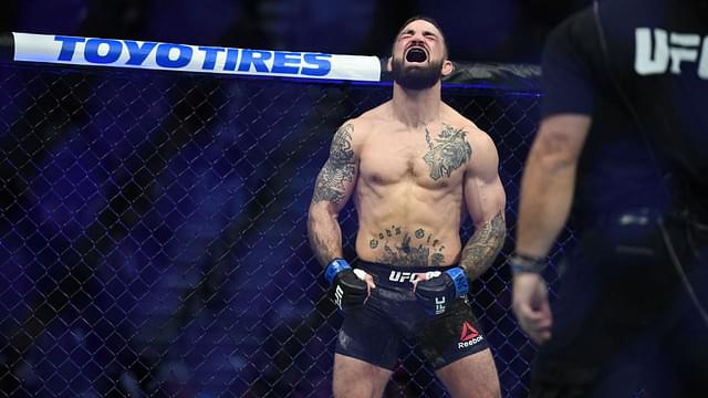 Mike Perry (blue gloves) reacts before a bout against Geoff Neal (not pictured) during UFC 245 at T-Mobile Arena.