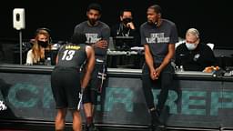 Brooklyn Nets point guard Kyrie Irving (C) and power forward Kevin Durant (R) talk to shooting guard James Harden (13) before checking into the game during the fourth quarter against the Los Angeles Clippers at Barclays Center.