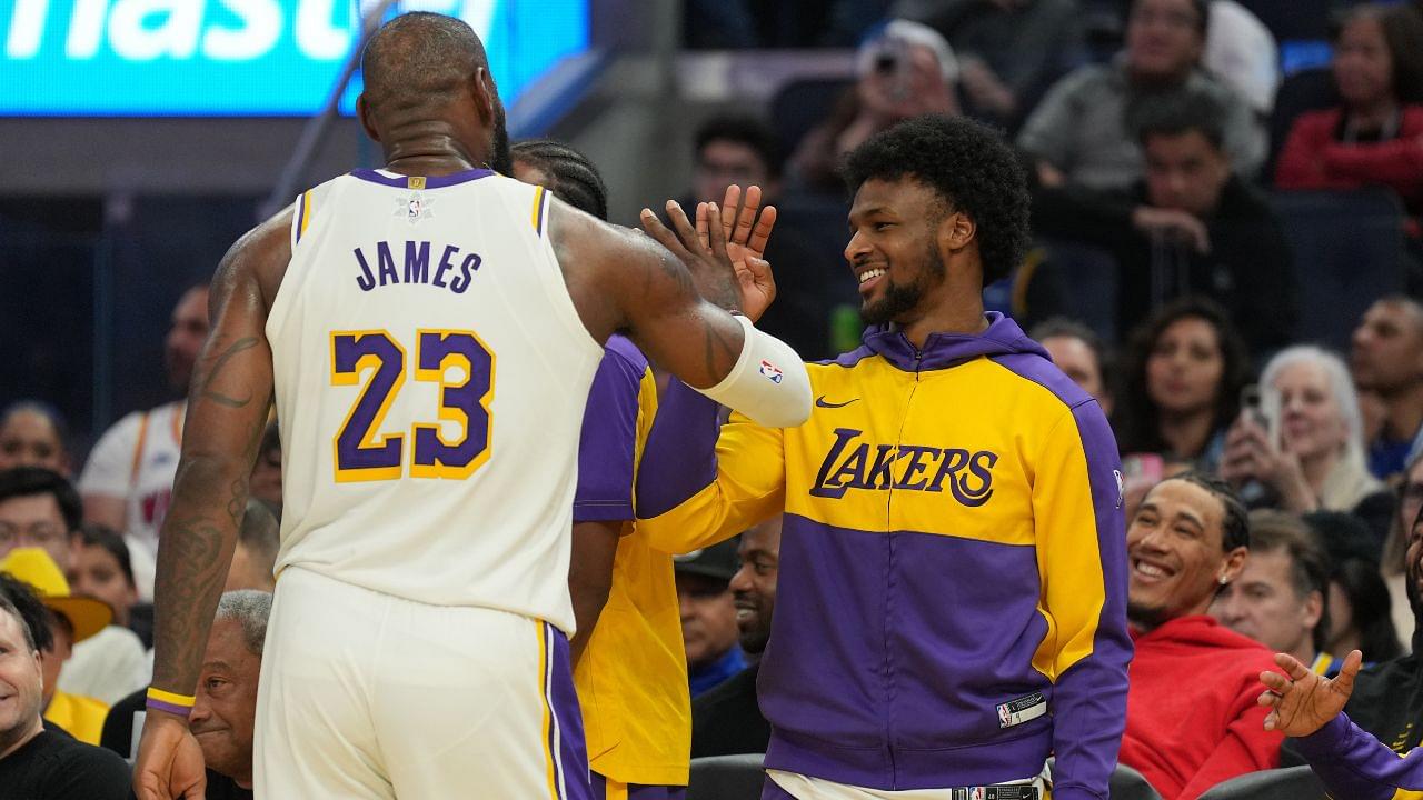 Los Angeles Lakers forward LeBron James (23) slaps hands with guard Bronny James (center right) during the third quarter against the Golden State Warriors at Chase Center