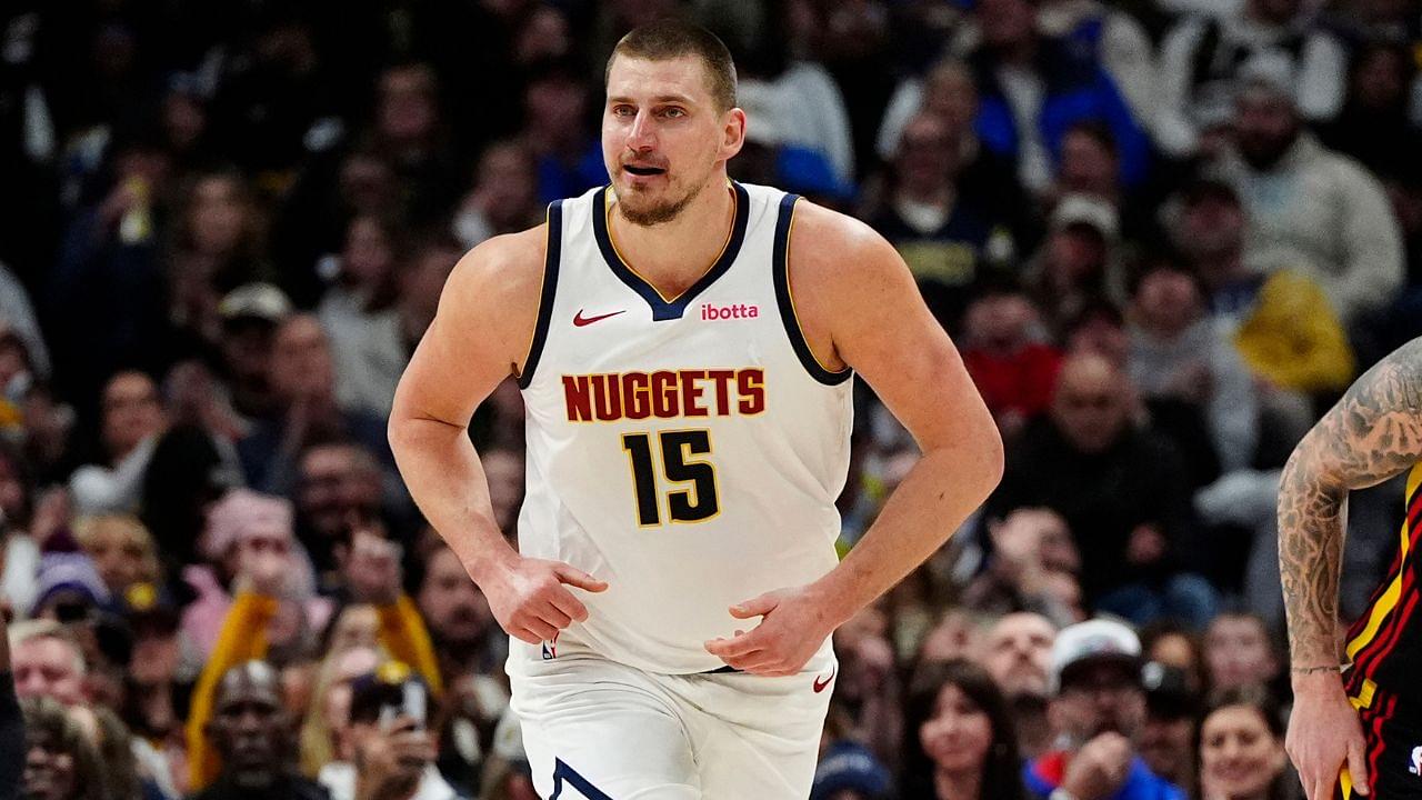 Denver Nuggets center Nikola Jokic (15) reacts back to the bench after scoring on his own rebounded ball in the second half against the Atlanta Hawks at Ball Arena.