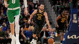 Golden State Warriors guard Stephen Curry (30) dribbles the ball up the court against the Boston Celtics in the third quarter at the Chase Center.