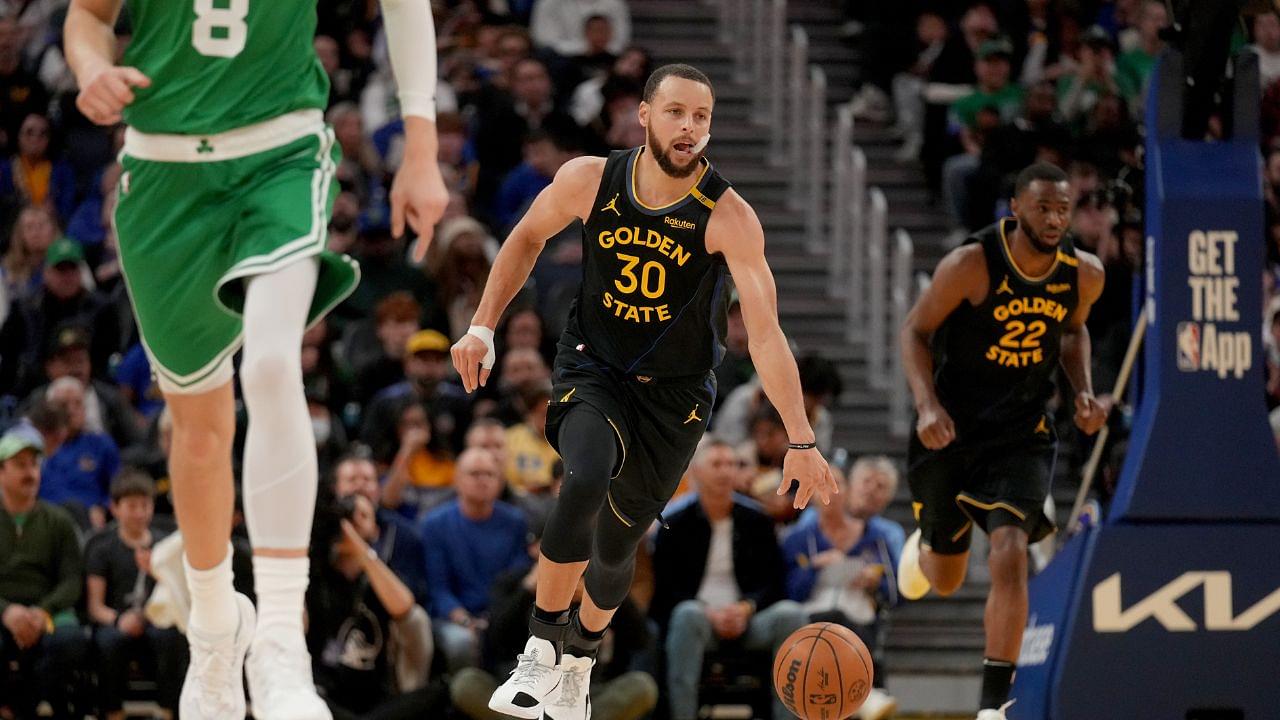 Golden State Warriors guard Stephen Curry (30) dribbles the ball up the court against the Boston Celtics in the third quarter at the Chase Center.