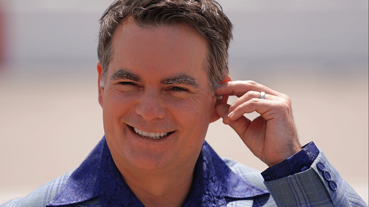 May 9, 2021; Darlington, South Carolina, USA; Fox Sports analyst and former NASCAR driver Jeff Gordon walks on pit road prior to the Goodyear 400 at Darlington Raceway. Mandatory Credit: Jasen Vinlove-Imagn Images